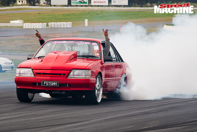 Performance car mania red holden vk commodore burnout